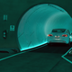 A Tesla car drives through a tunnel in the Central Station during a media preview of the Las Vegas Convention Center Loop on April 9, 2021 in Las Vegas, Nevada.
